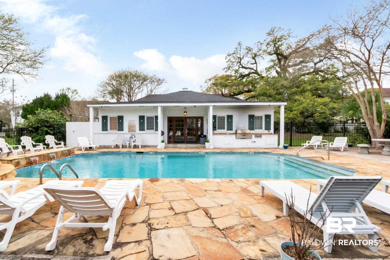 214 Upham Street, Unit 17C Mobile, AL 36607 - Photo 9 of 32 View of pool with patio surround, a grill, french doors, and an outdoor structure