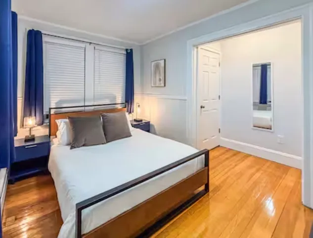 a bed room with a bed and a window