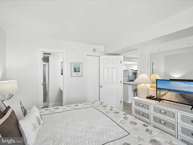 a bedroom with a bed and dresser