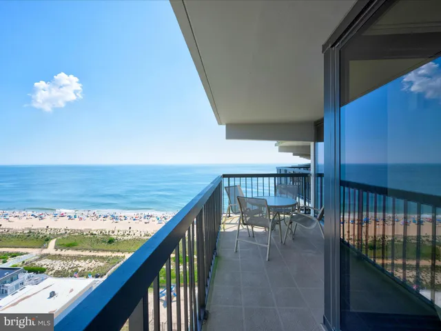 a view of a balcony with chairs