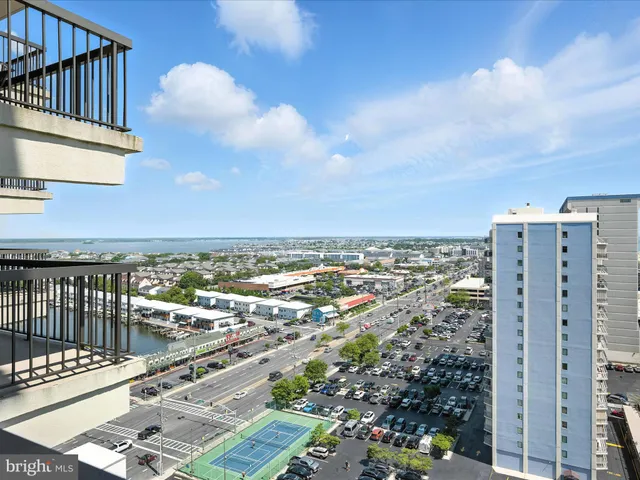 a view of a balcony with city view