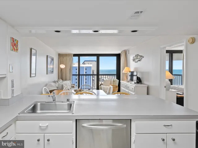 a bedroom with furniture and a large window