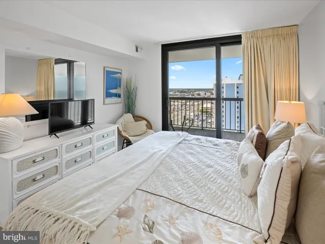 a bedroom with a bed and flat screen tv