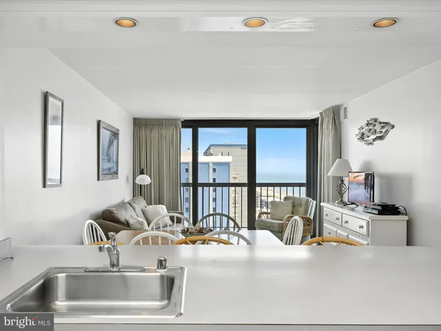 a kitchen with a sink and a refrigerator