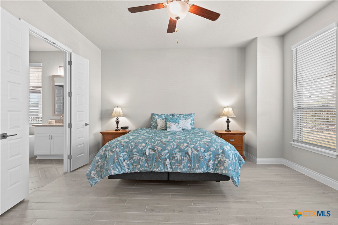 477 Vamanos Boerne, TX 78006 - Photo 15 of 29 a bedroom with a bed and a window