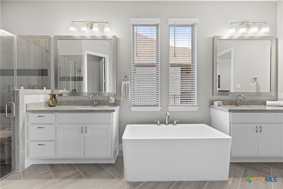 477 Vamanos Boerne, TX 78006 - Photo 18 of 29 a bathroom with a sink double vanity and a mirror