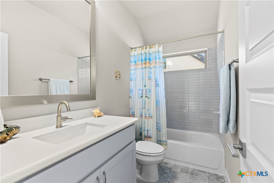 477 Vamanos Boerne, TX 78006 - Photo 22 of 29 a bathroom with a sink a toilet and shower