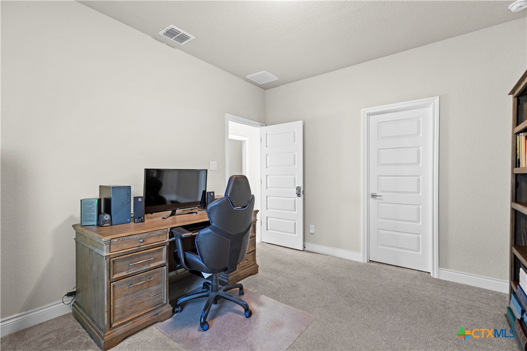 477 Vamanos Boerne, TX 78006 - Photo 24 of 29 a view of a workspace with furniture