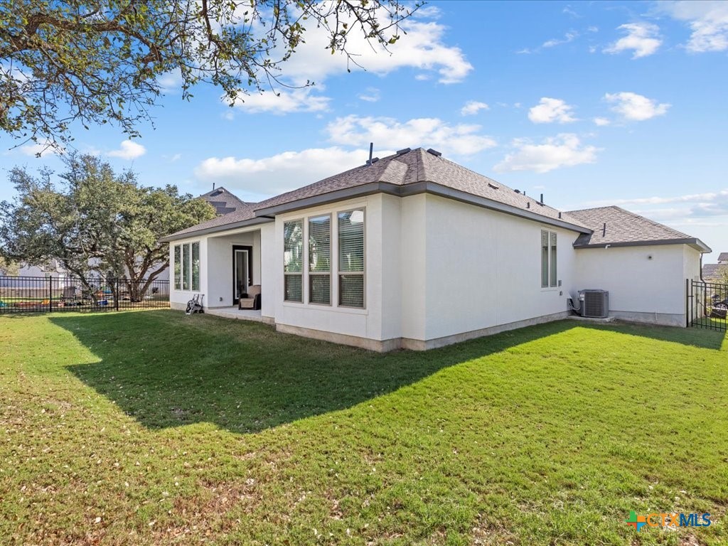 477 Vamanos Boerne, TX 78006 - Photo 27 of 29 a view of a house with a backyard
