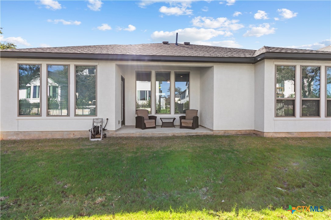 477 Vamanos Boerne, TX 78006 - Photo 29 of 29 a view of a house with backyard sitting area and porch