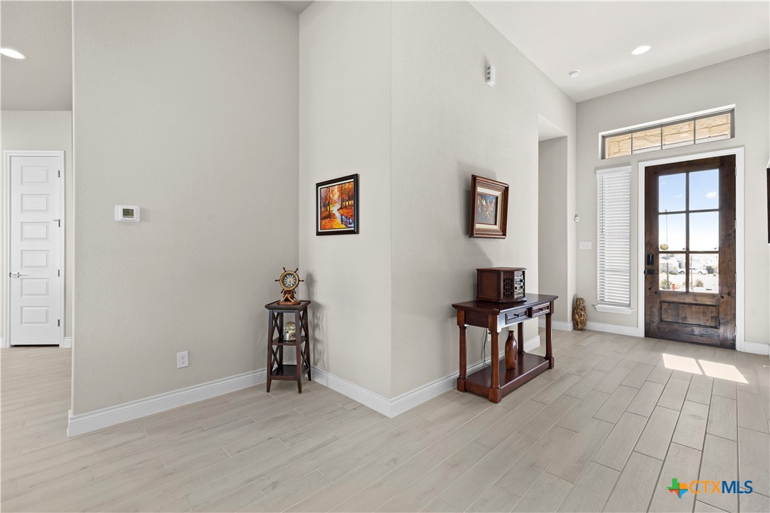 477 Vamanos Boerne, TX 78006 - Photo 5 of 29 a view of a livingroom with workspace and a window