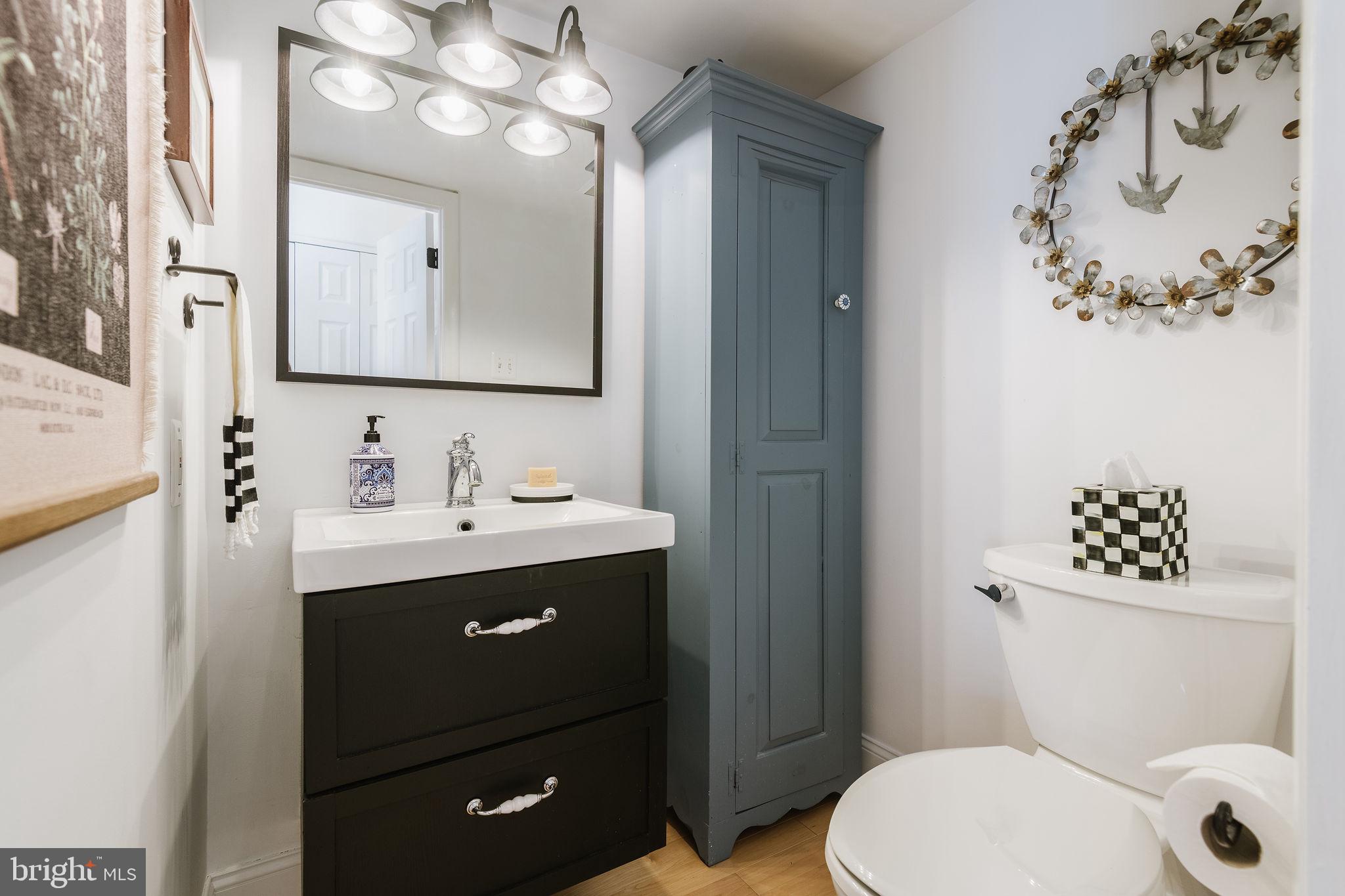 532 North Lemon Street Media, PA 19063 - Photo 15 of 63 a bathroom with a sink vanity mirror and toilet