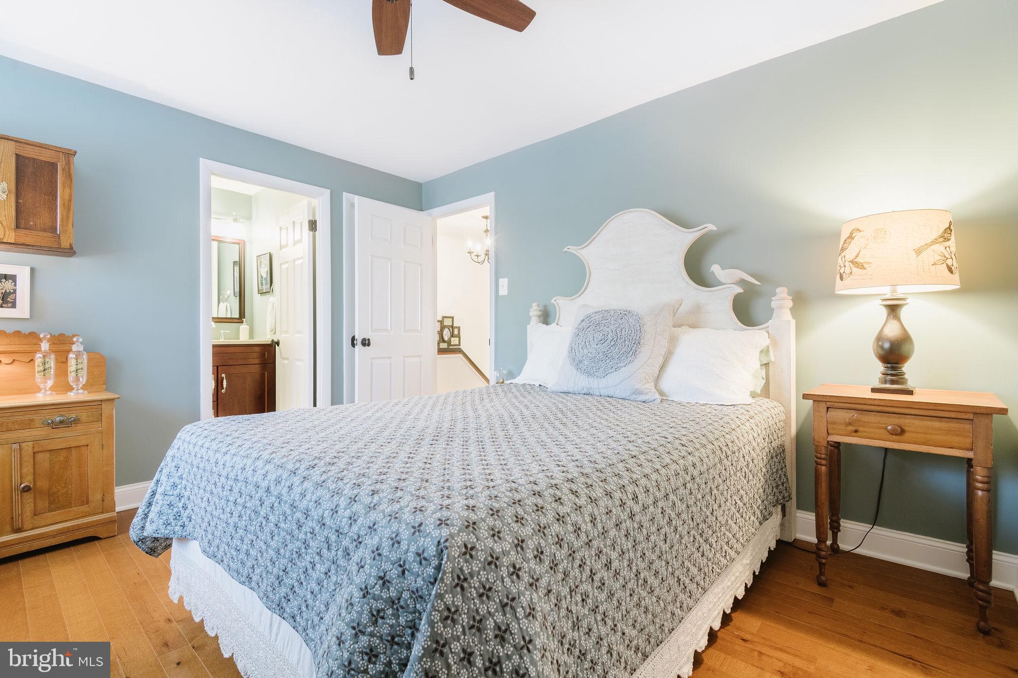 532 North Lemon Street Media, PA 19063 - Photo 37 of 63 a bedroom with a bed and a chandelier