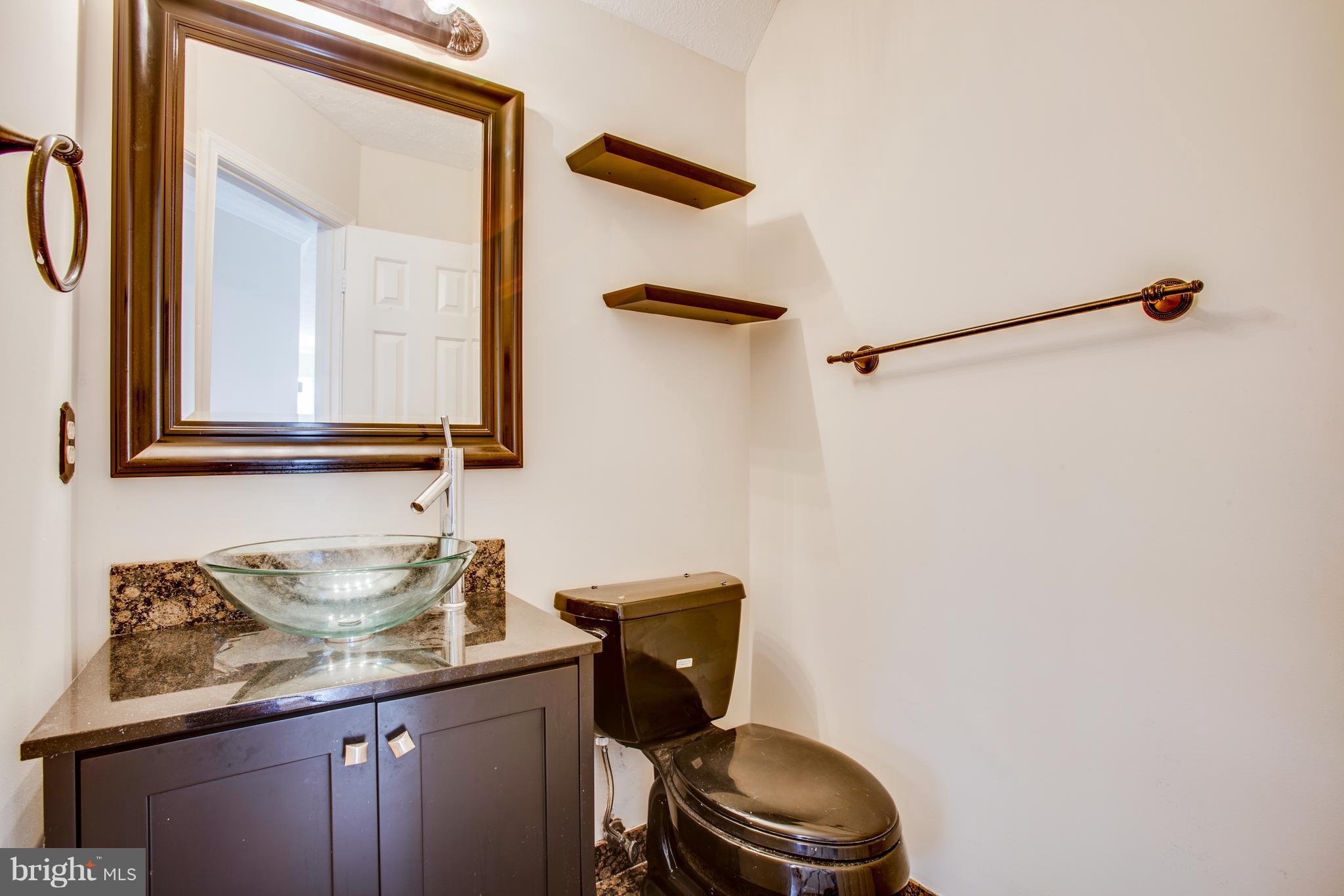 5 Wells Road Stafford, VA 22556 - Photo 12 of 28 a bathroom with a granite countertop sink and a mirror
