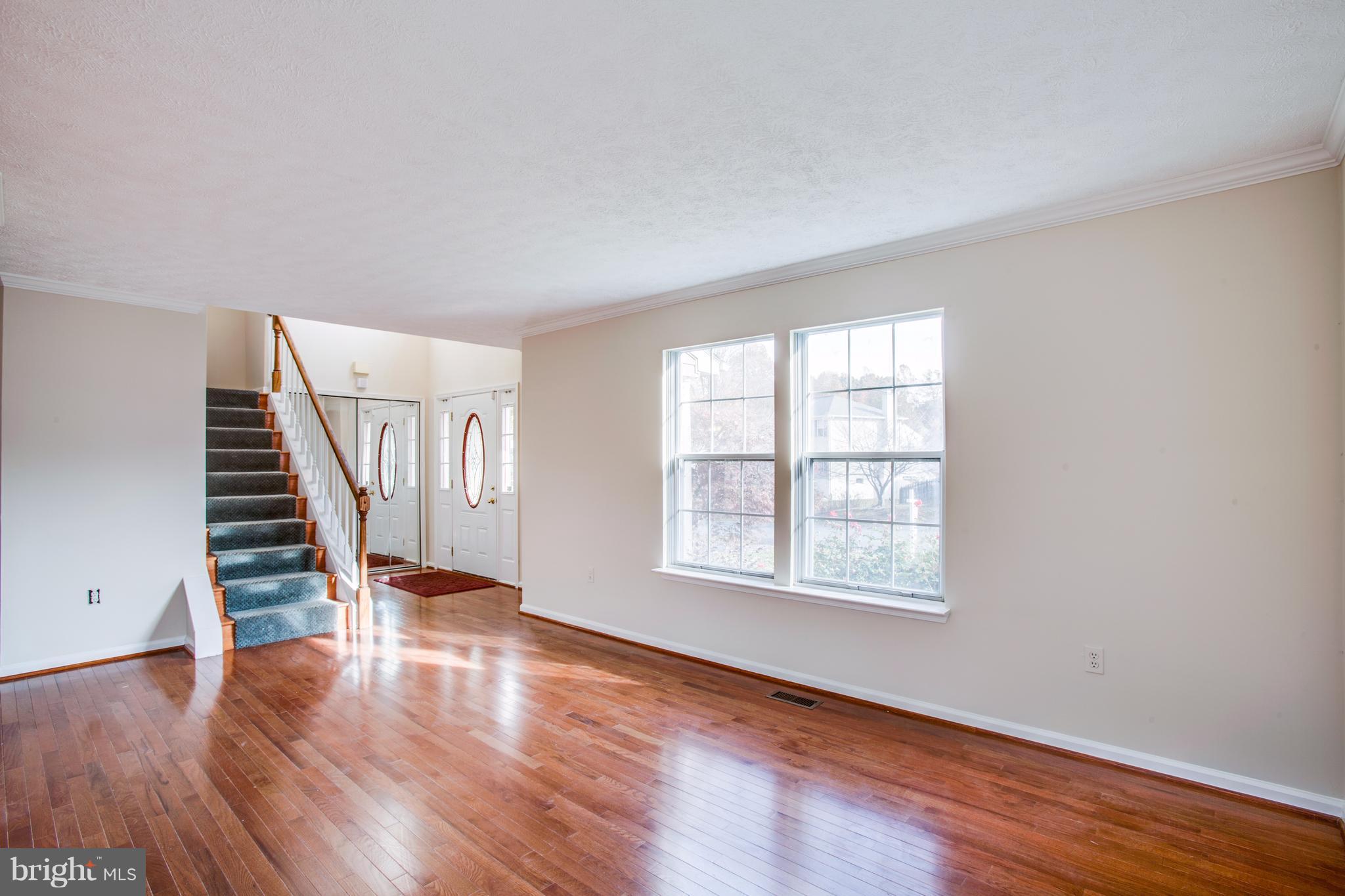 5 Wells Road Stafford, VA 22556 - Photo 3 of 28 wooden floor in an empty room with a window