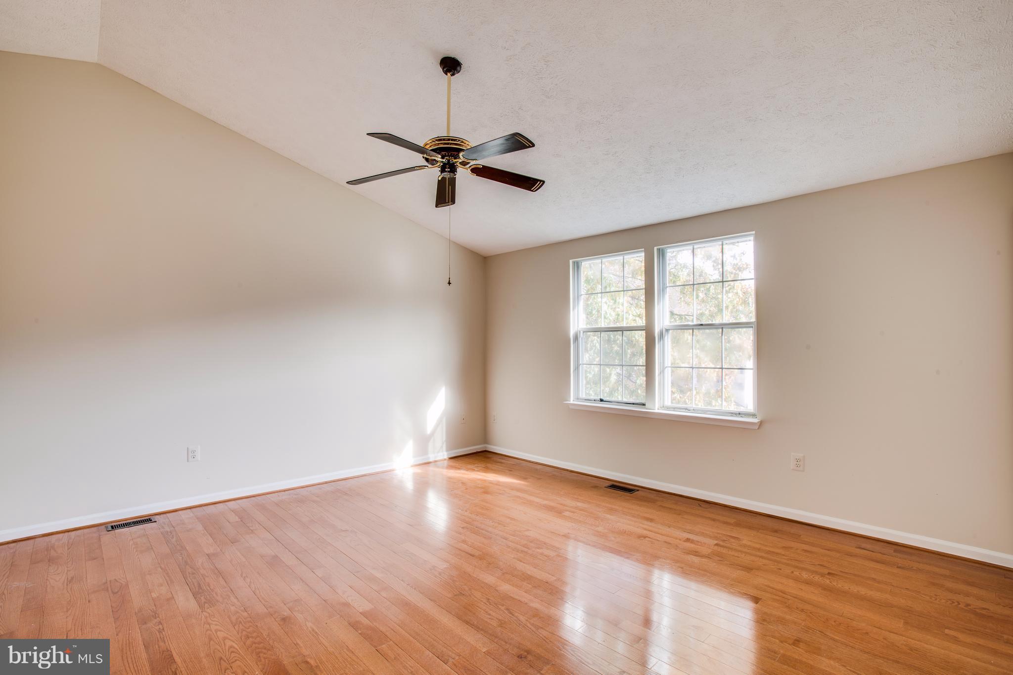 5 Wells Road Stafford, VA 22556 - Photo 21 of 28 wooden floor in an empty room with a window