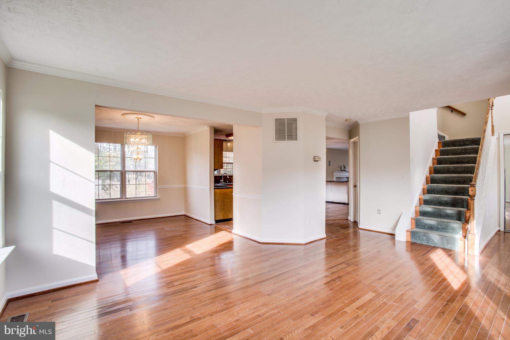 5 Wells Road Stafford, VA 22556 - Photo 4 of 28 a view of empty room with wooden floor and kitchen