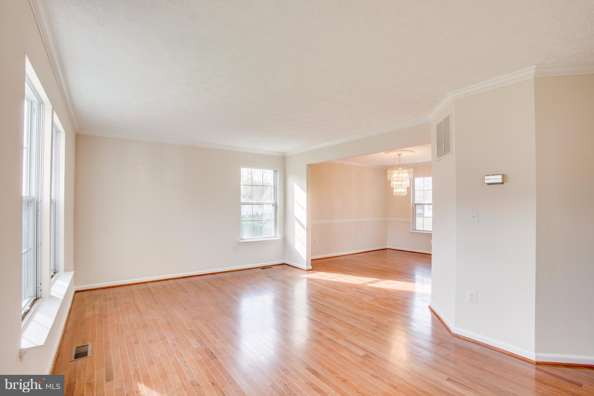 5 Wells Road Stafford, VA 22556 - Photo 5 of 28 an empty room with wooden floor and windows