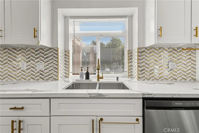 a view of a hallway with wooden floor and closet