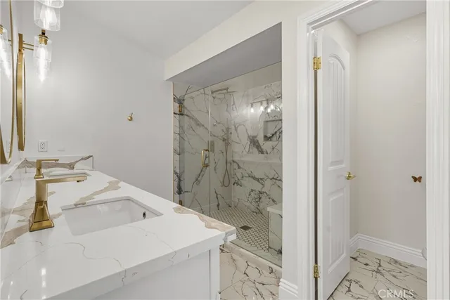 a bathroom with a double vanity sink and a mirror