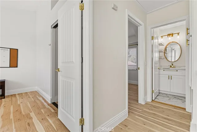 a bedroom with a bed and a ceiling fan