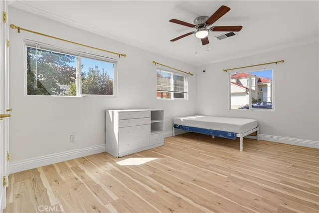 a view of a patio with couches chairs and a potted plant