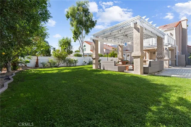 an aerial view of a house with a yard and garden