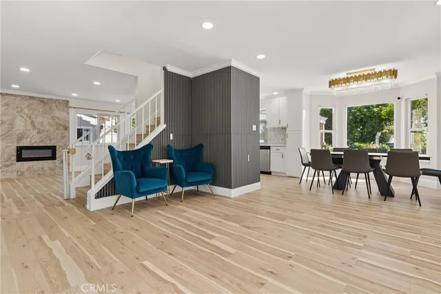 a view of a kitchen with dining room and wooden floor