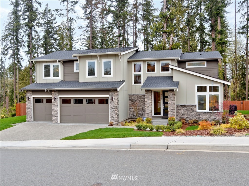23309 17th Avenue Southeast Bothell, WA 98021 - Photo 1 of 1 a front view of a house with a yard and garage
