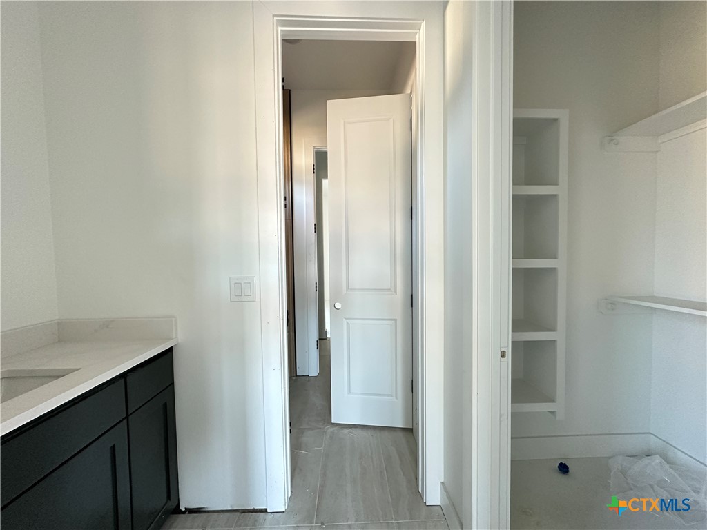 430 Dos Rios Drive Belton, TX 76513 - Photo 11 of 29 a view of hallway with sink and wooden floor