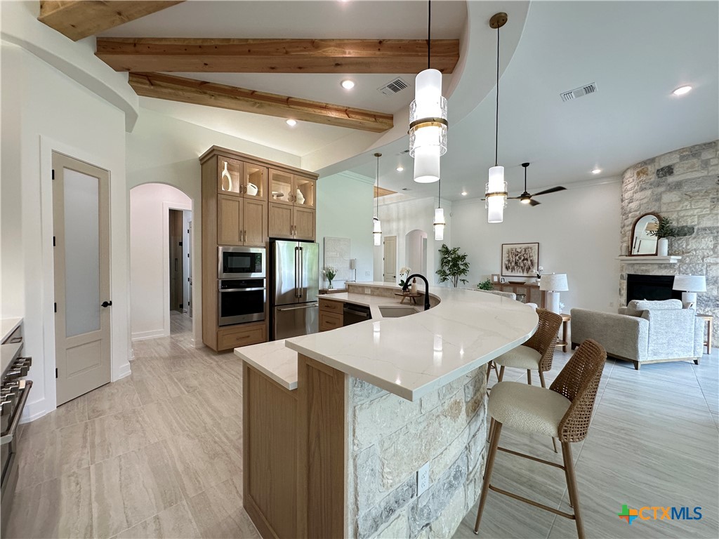430 Dos Rios Drive Belton, TX 76513 - Photo 12 of 48 a large kitchen with a table and chairs