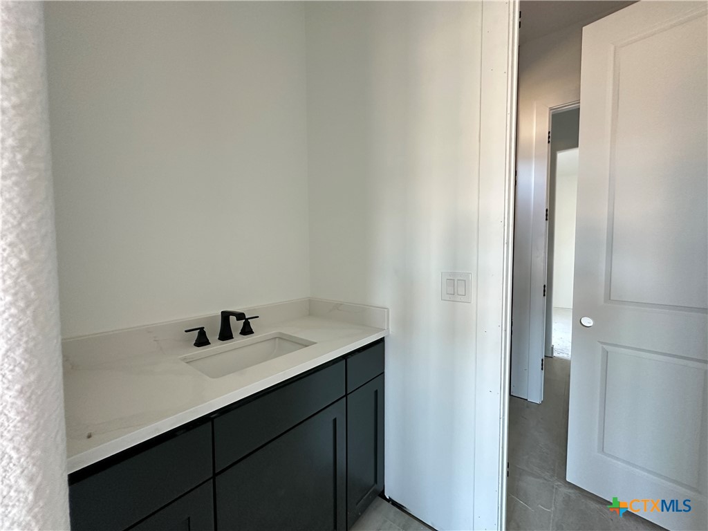 430 Dos Rios Drive Belton, TX 76513 - Photo 12 of 29 a bathroom with a sink and a mirror