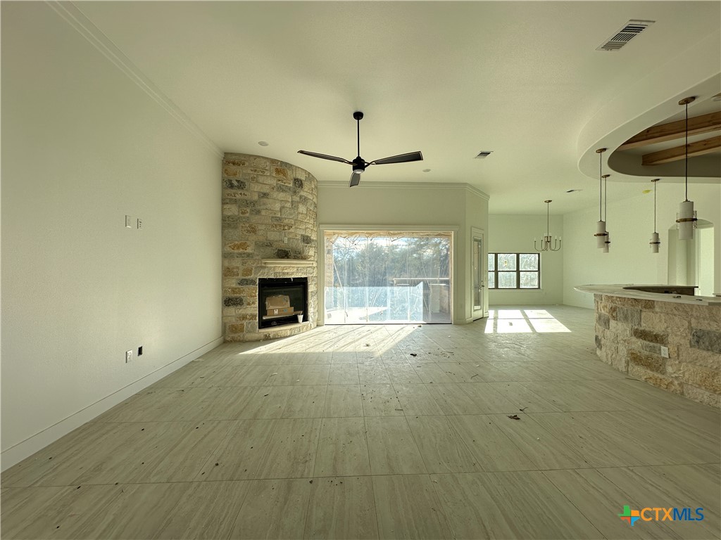 430 Dos Rios Drive Belton, TX 76513 - Photo 2 of 29 a view of an empty room with a fireplace and a window