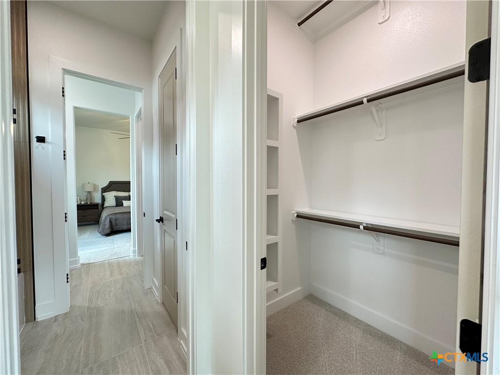 430 Dos Rios Drive Belton, TX 76513 - Photo 24 of 48 a view of a livingroom with a hardwood floor and a hallway