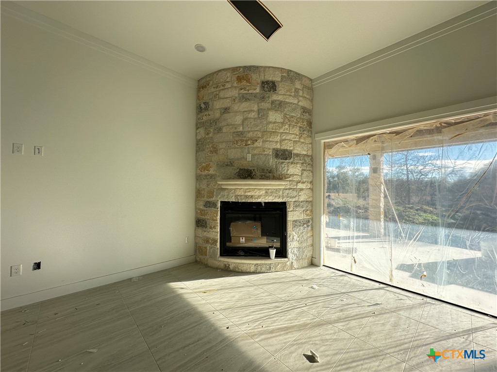 430 Dos Rios Drive Belton, TX 76513 - Photo 4 of 29 a view of an empty room with a fireplace