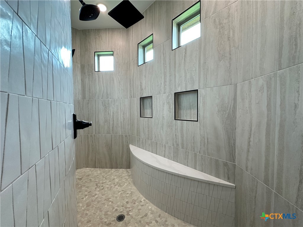 430 Dos Rios Drive Belton, TX 76513 - Photo 41 of 48 a bathroom with a bathtub and shower