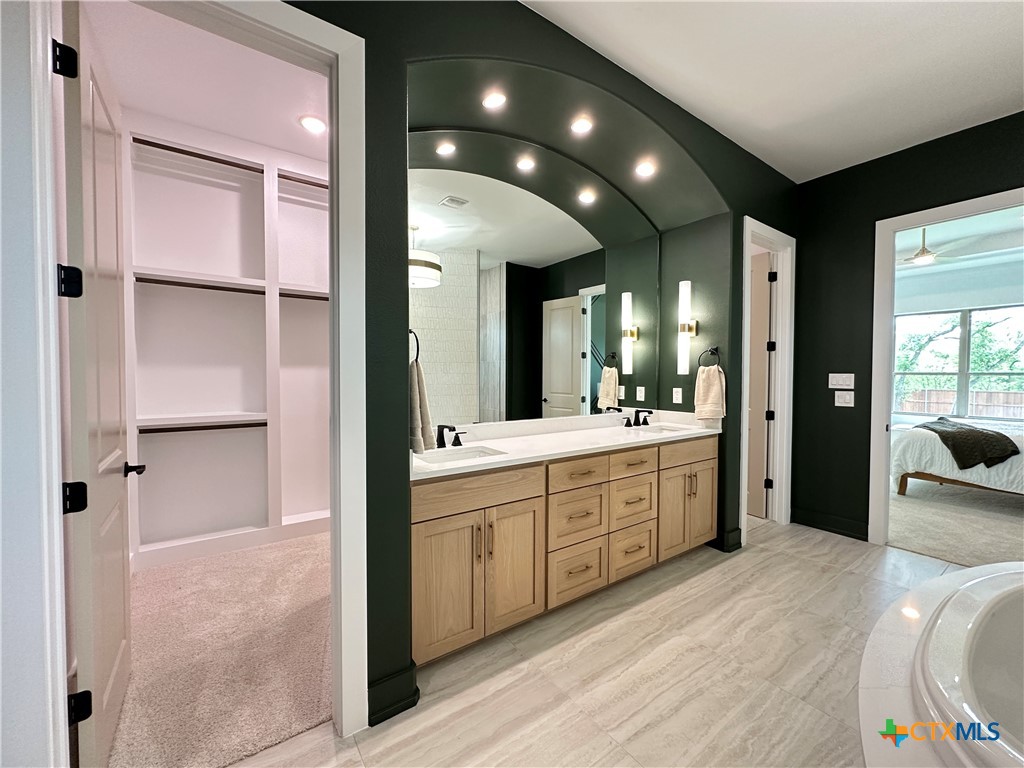 430 Dos Rios Drive Belton, TX 76513 - Photo 43 of 48 a spacious bathroom with a granite countertop sink mirror and shower