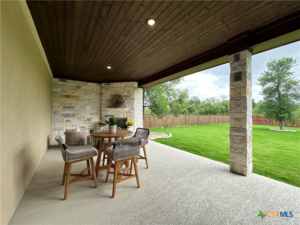430 Dos Rios Drive Belton, TX 76513 - Photo 47 of 48 a view of a patio with a table chairs and a yard
