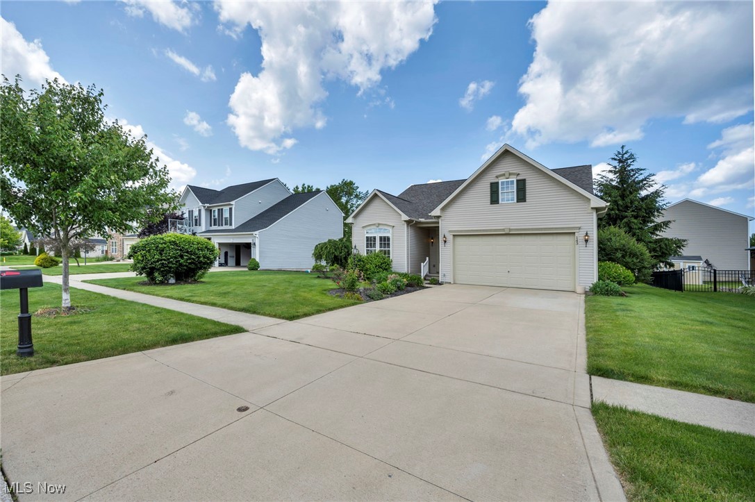 143 Stone Ridge Way Berea, OH 44017 - Photo 36 of 47 Traditional-style house featuring a garage, concrete driveway, and a residential view