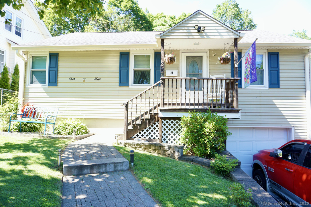 a front view of a house with a garden