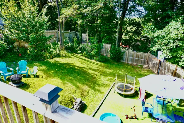 a view of yard from a dining room