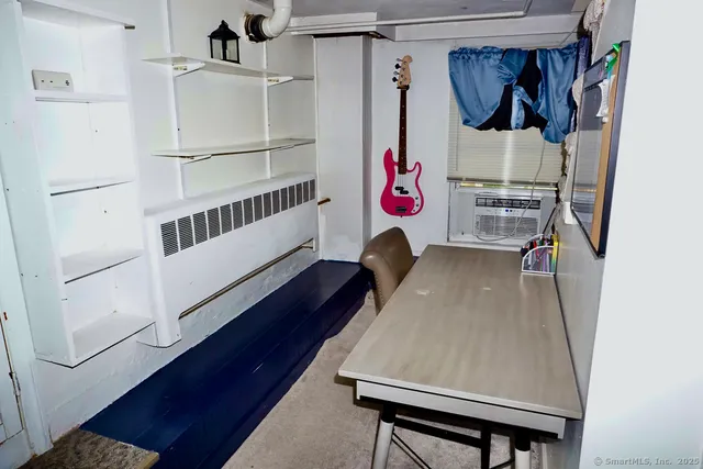 a living room with furniture and flat screen tv