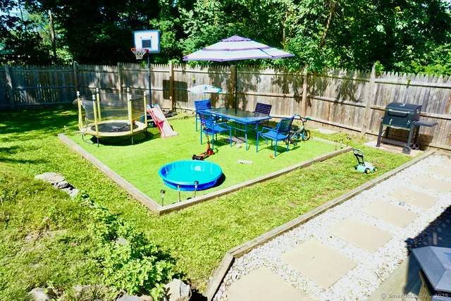 a view of yard from a dining room