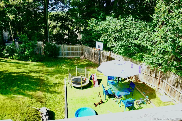 a backyard of a house with lots of green space
