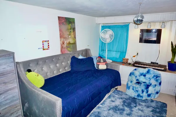a living room with furniture and flat screen tv