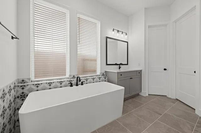 a bathroom with a bathtub and a sink