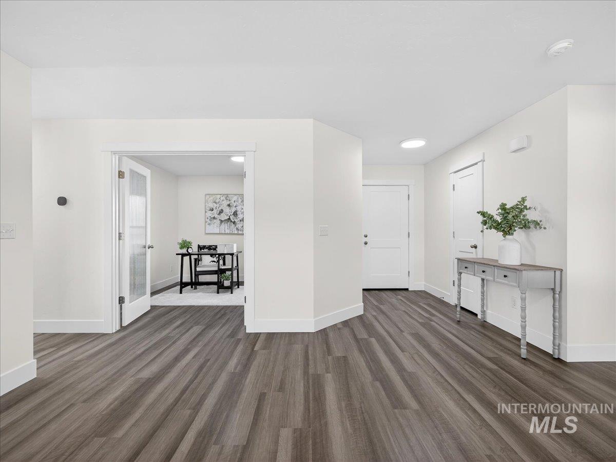 1410 Regency Way Emmett, ID 83617 - Photo 16 of 46 Entryway featuring baseboards and dark wood finished floors