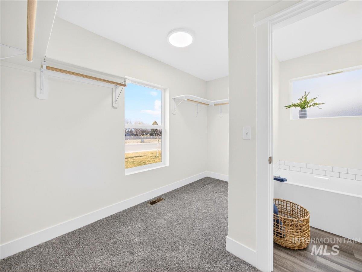 1410 Regency Way Emmett, ID 83617 - Photo 25 of 46 Walk in closet featuring carpet flooring