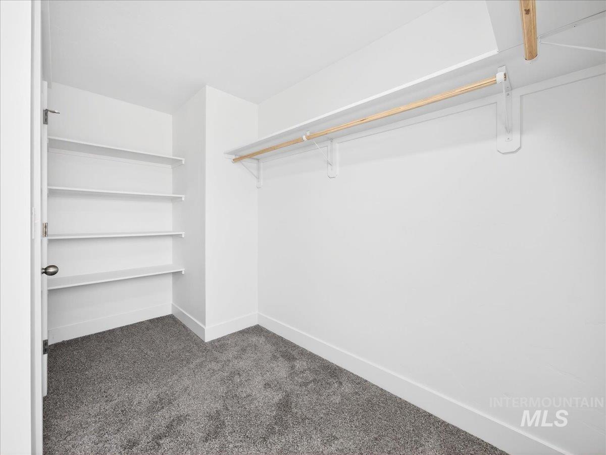 1410 Regency Way Emmett, ID 83617 - Photo 26 of 46 Walk in closet featuring dark colored carpet