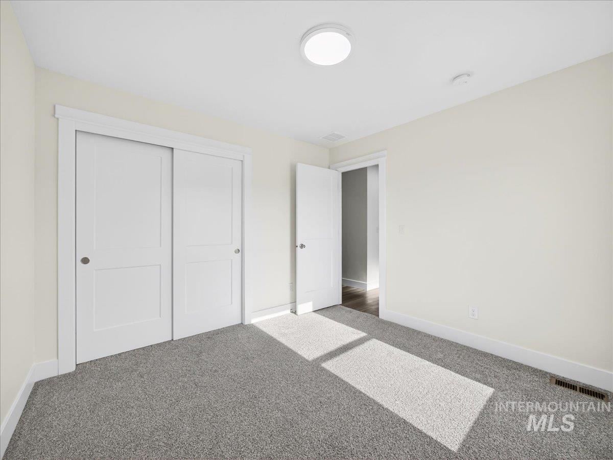 1410 Regency Way Emmett, ID 83617 - Photo 29 of 46 Unfurnished bedroom featuring carpet flooring and a closet